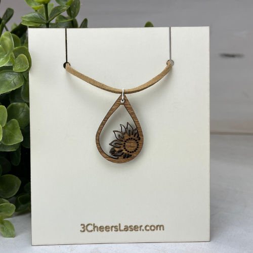 Sunflower Drop wood laser cut necklaces. These necklaces are available in two sizes, and are on a 18" soft suede leather strap that adds to the beauty of the laser cut wood. A beautiful gift that will be treasured and can be worn with jeans and a t-shirt or looks great when you want to get dressed up.