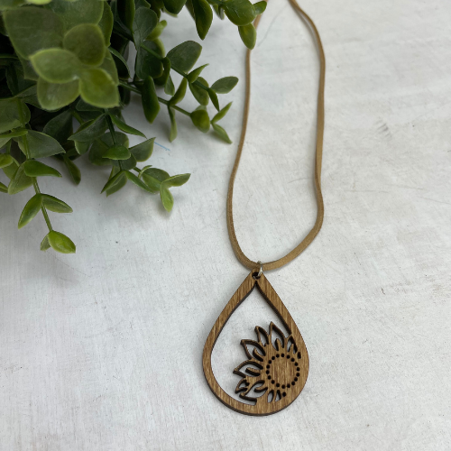 Sunflower Drop wood laser cut necklaces. These necklaces are available in two sizes, and are on a 18" soft suede leather strap that adds to the beauty of the laser cut wood. A beautiful gift that will be treasured and can be worn with jeans and a t-shirt or looks great when you want to get dressed up.